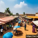 토고에서 바가지 피하는 법 - A vibrant outdoor market scene in Lomé, Togo, bustling with local vendors and shoppers. Stalls displ...